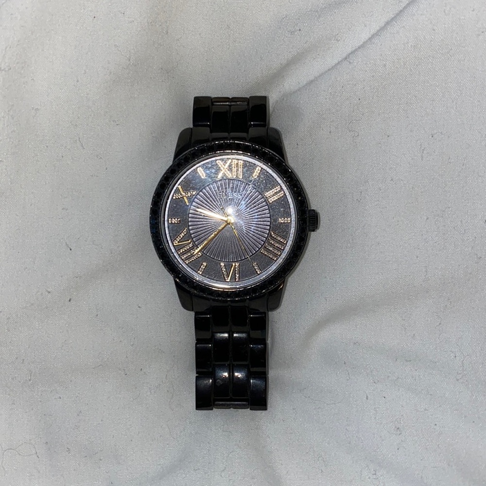 Black and good guess watch with medal links.